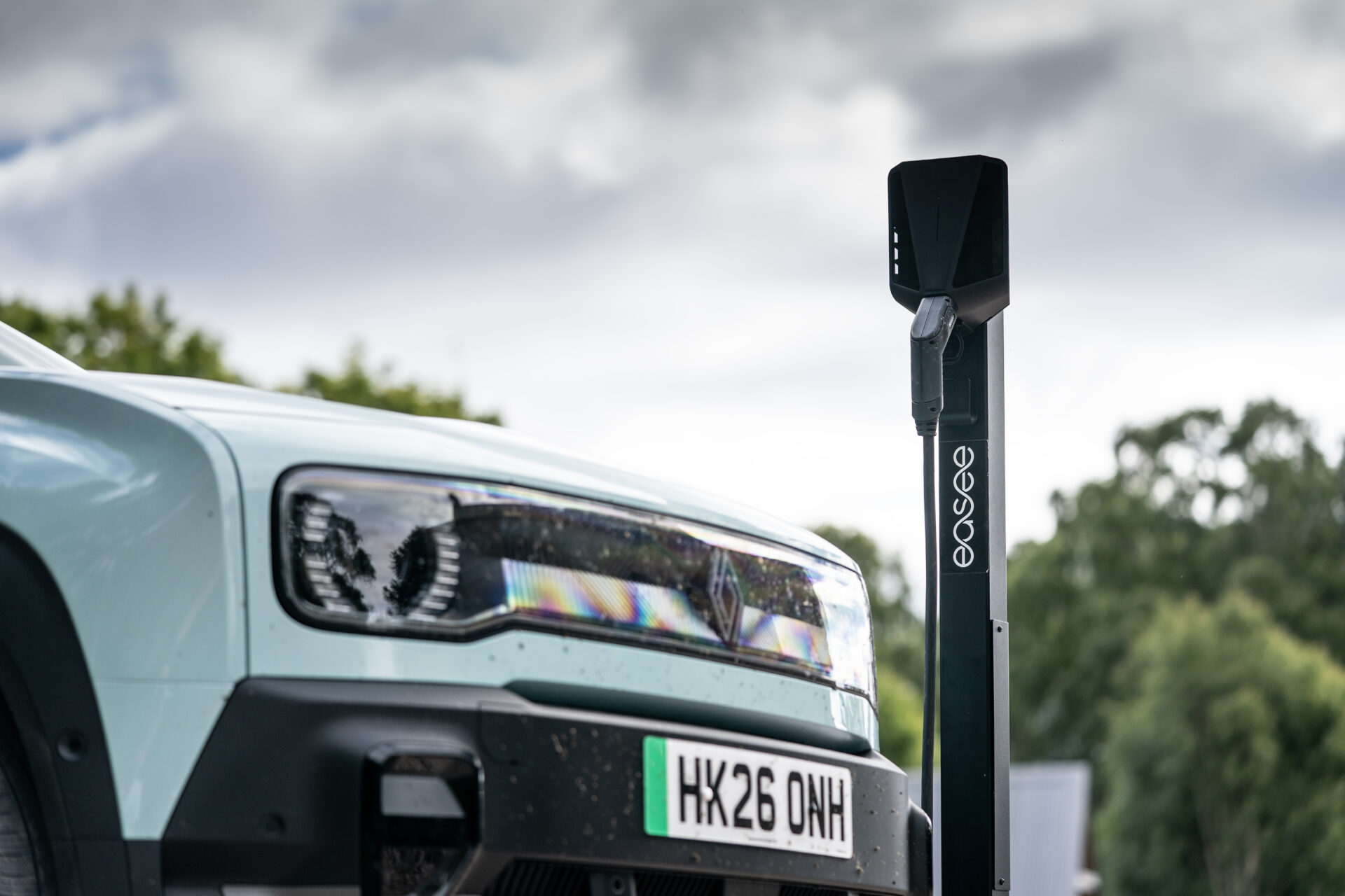 A technician in a workshop diagnosing one of the UK's new zero-emission vehicles, highlighting the need for specialist