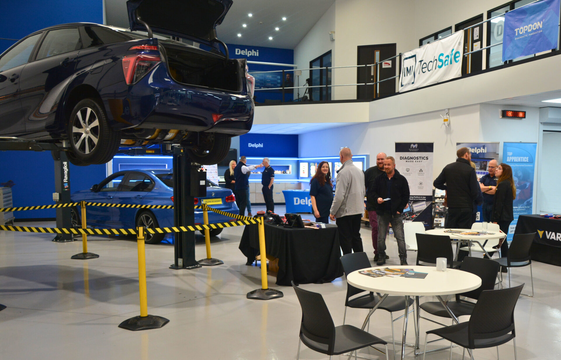 A technician works on an engine during the live fault-finding challenges at the Top Awards finals.
