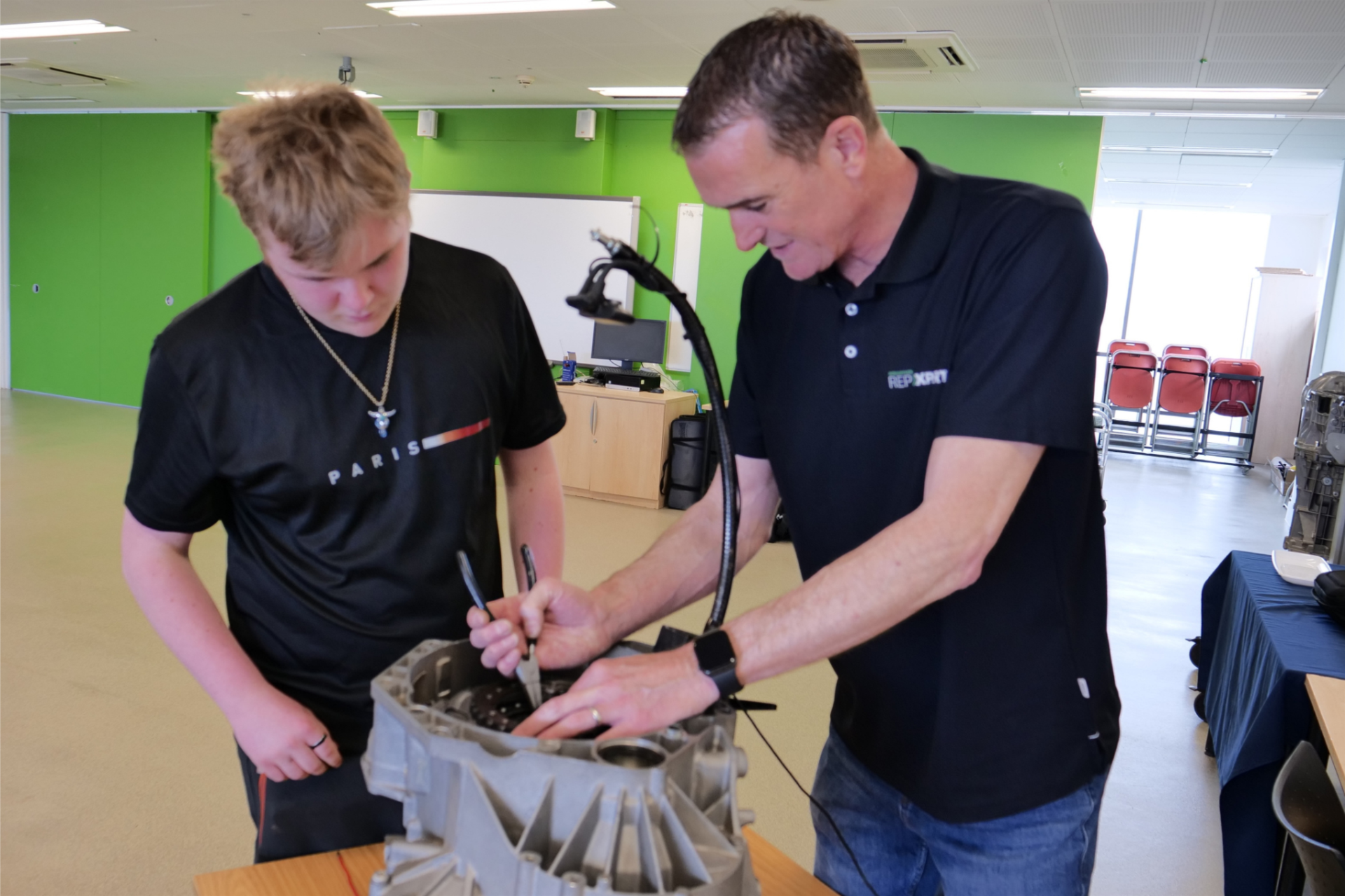 Schaeffler's Alistair Mason delivering hands-on clutch system training to motor vehicle students at Herefordshire College.