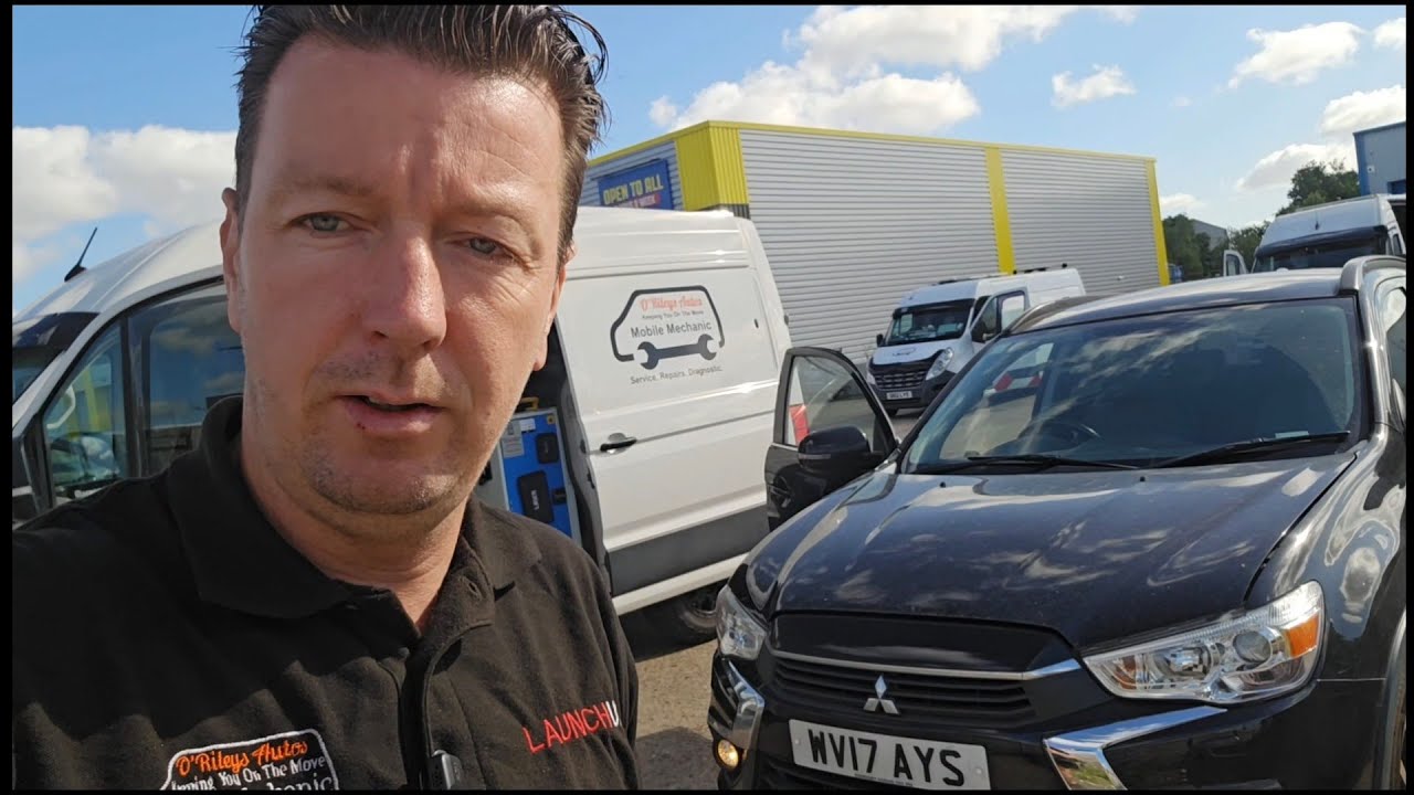 Technician Stevie O'Reilly diagnosing a Mitsubishi ASX DPF fault and oil dilution issue in the workshop.