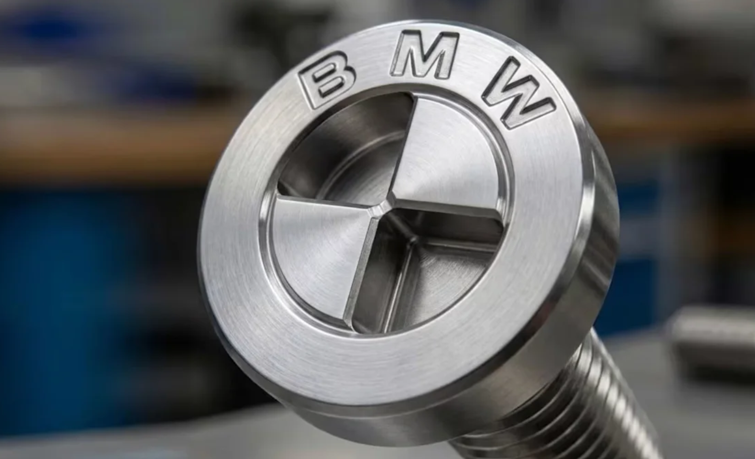Technician working on a BMW, with the article clarifying the legal position on any potential hardware lockout.