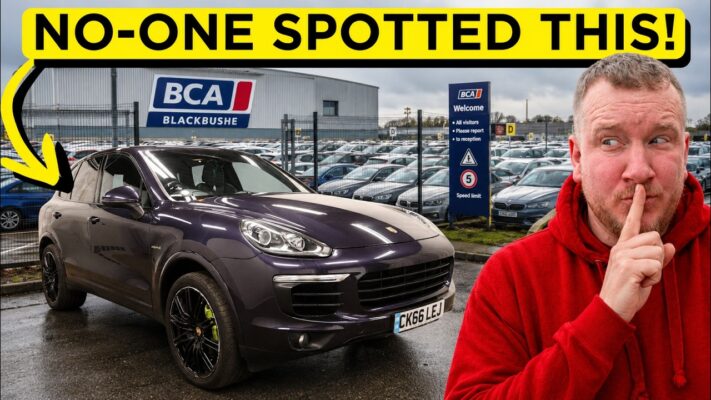 Mechanics from Shifting Metal working on the noisy front differential of a purple 2016 Porsche Cayenne S on a vehicle lift.