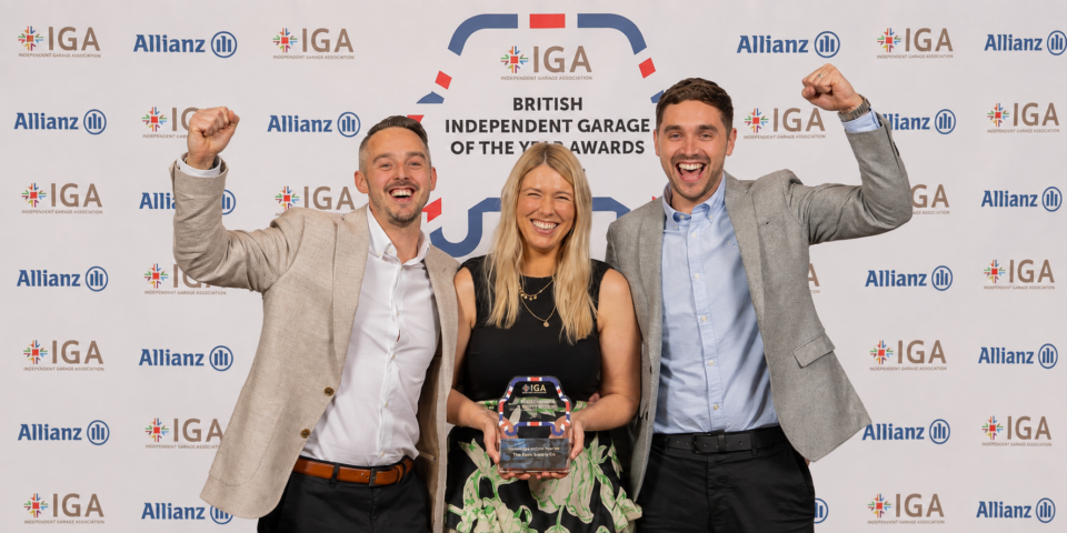 The stage at the British Independent Garage Awards, with the IGA and Allianz logos displayed on screens.
