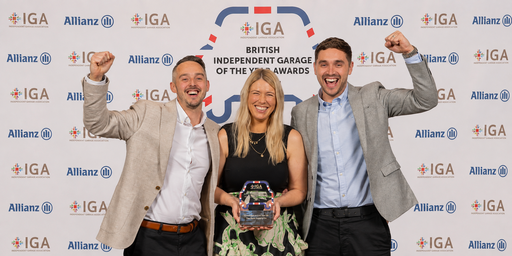 The stage at the British Independent Garage Awards, with the IGA and Allianz logos displayed on screens.