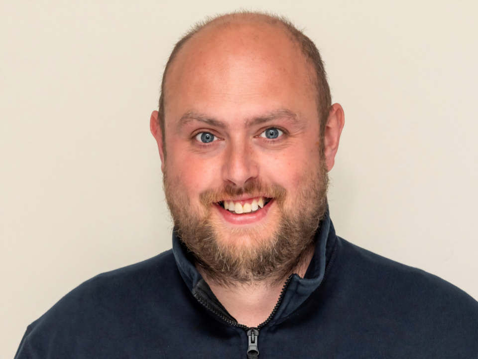 Danny Huscroft, the new client lead for Garage Services Online, in a professional headshot.