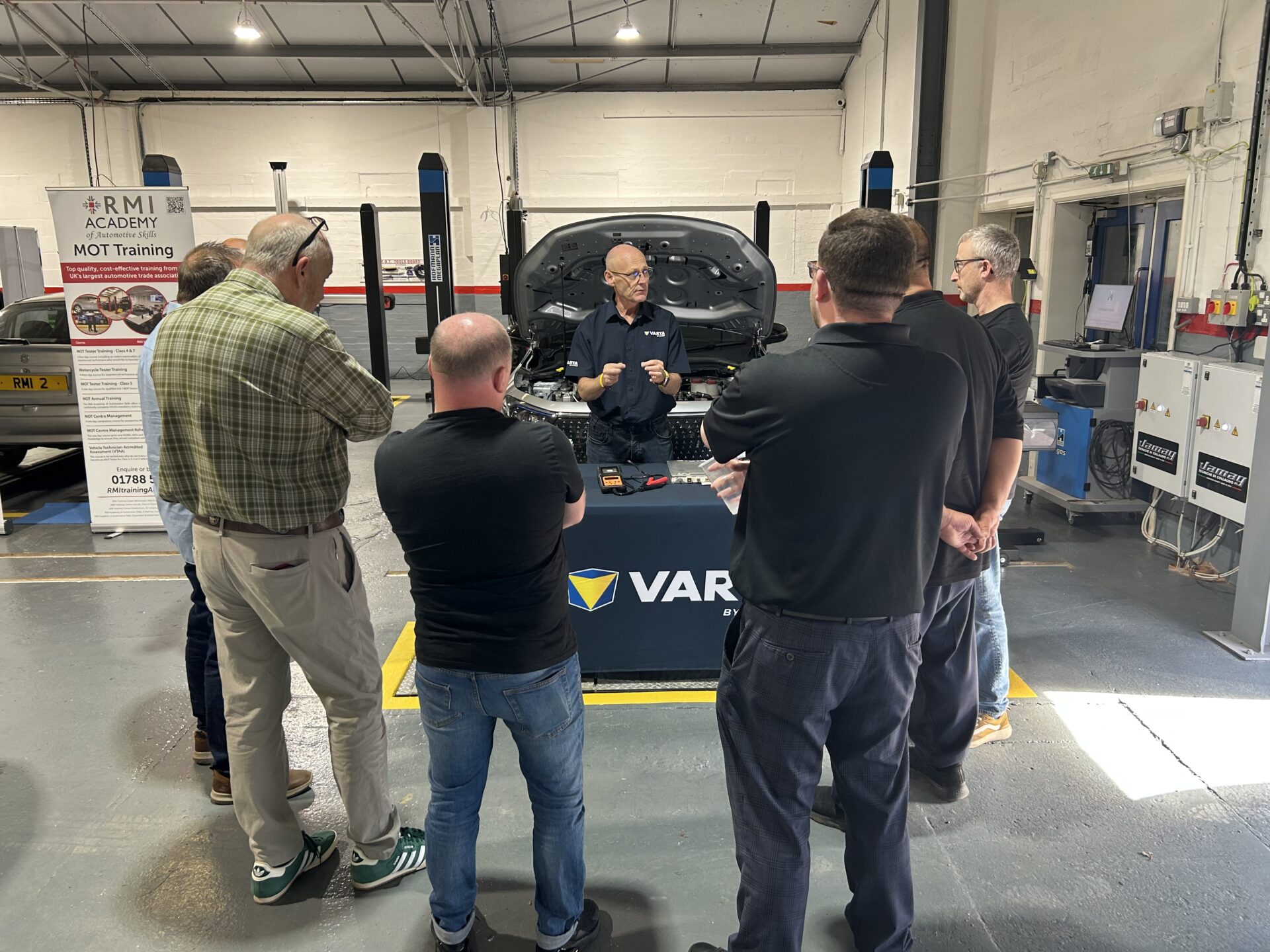 Technicians attend a practical demonstration at the IGA Insider Live event in the RMI Academy workshop.