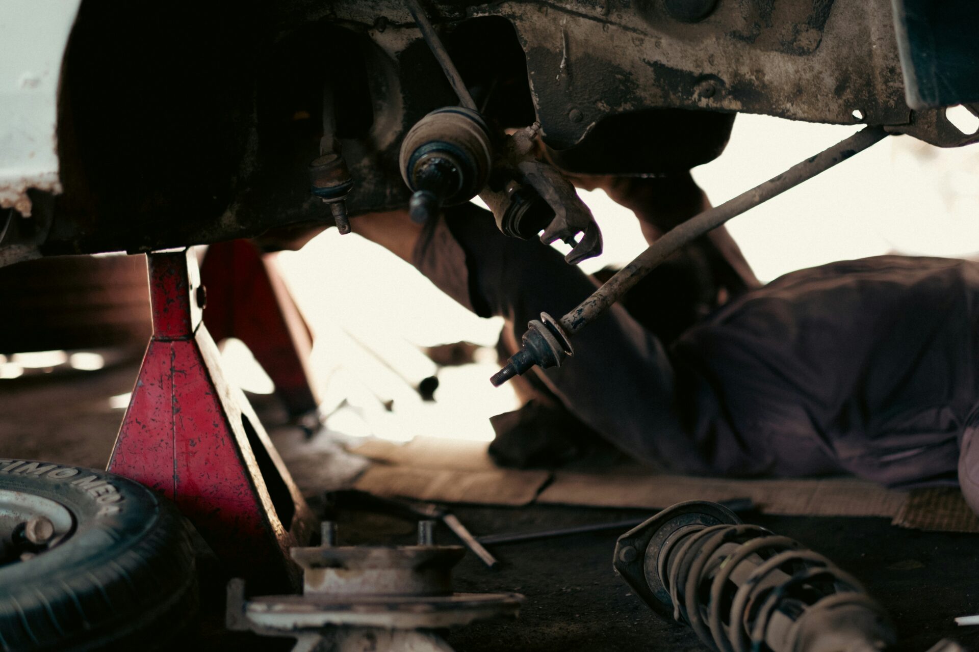 Garage technicians in a workshop discussing the 'Embracing Neurodiversity' training from automotive charity Ben.