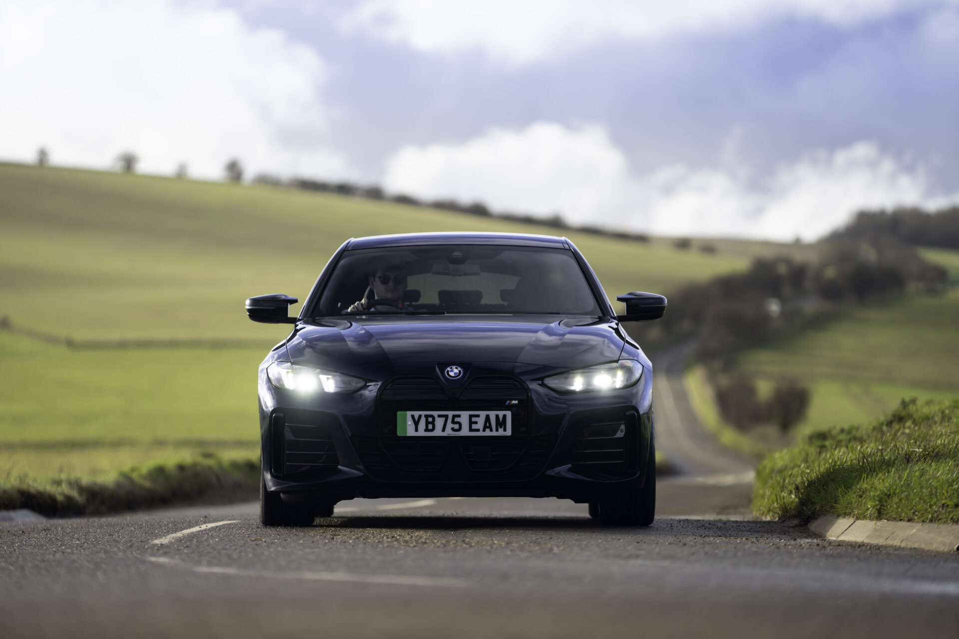 An electric car plugged into a charger, illustrating the impact of the ZEV mandate on UK driver buying intentions.