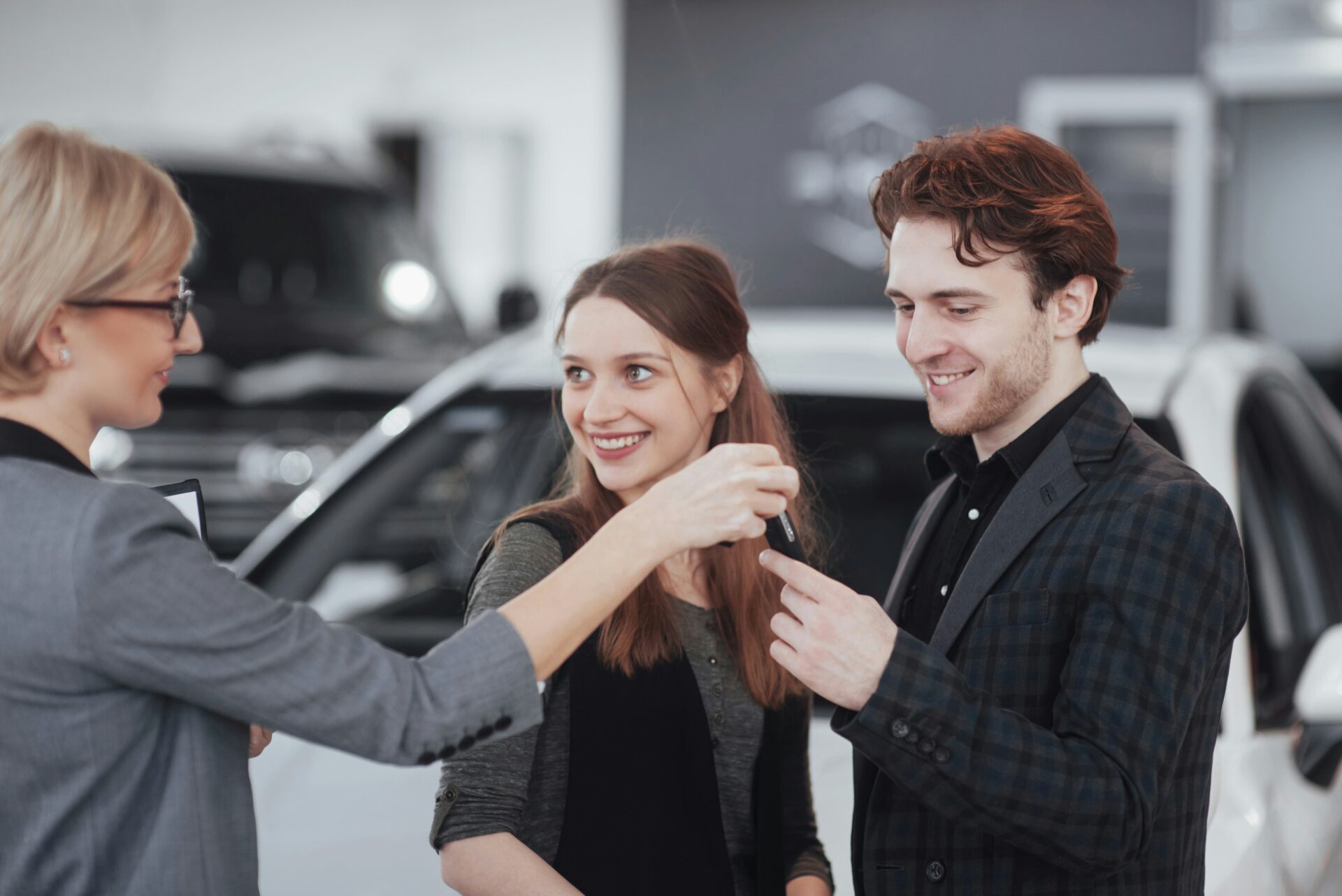 A technician performs a pre-purchase inspection on a car's engine, looking for any sign of an expensive fault before a sale.